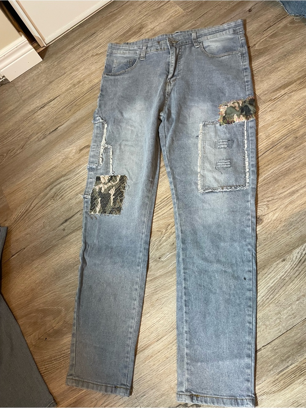 Light Wash Patchwork Jeans with Camouflage Accents